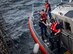 Coast Guardsmen secure communications equipment to a line to bring it aboard USS Thomas Hudner (DDG 116) in the Gulf of Mexico Dec. 16, 2019. The Navy used that equipment during the first demonstration of the Advanced Battle Management System, operators across the Air Force, Army, Navy and industry tested multiple real-time data sharing tools and technology in a homeland defense-based scenario enacted by U.S. Northern Command and enabled by Air Force senior leaders at Eglin Air Force Base, Fla., Dec. 16-18. (U.S. Air Force photo by 2nd Lt. Karissa Rodriguez)