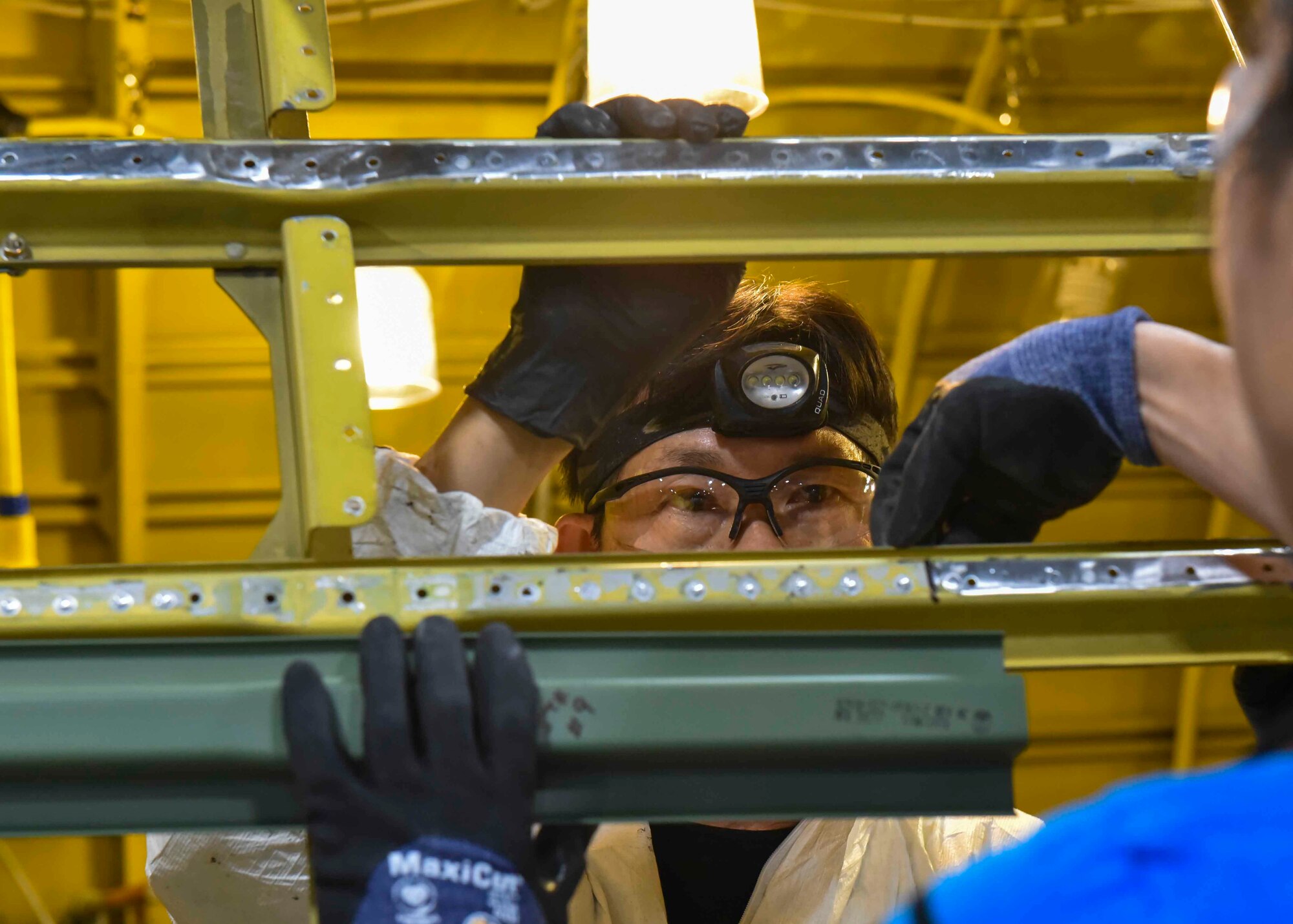 A 564th Aircraft Maintenance Squadron worker assists with programmed depot maintenance on a KC-135 Stratotanker at the Oklahoma City Air Logistics Complex on Tinker Air Force Base, Oklahoma, Nov. 23, 2019. Once PDM is complete, Airmen from the aircraft’s home station tour the OC-ALC to discuss with the workers common defects they’re experiencing with the aircraft. (U.S. Air Force photo by Airman Kiaundra Miller)
