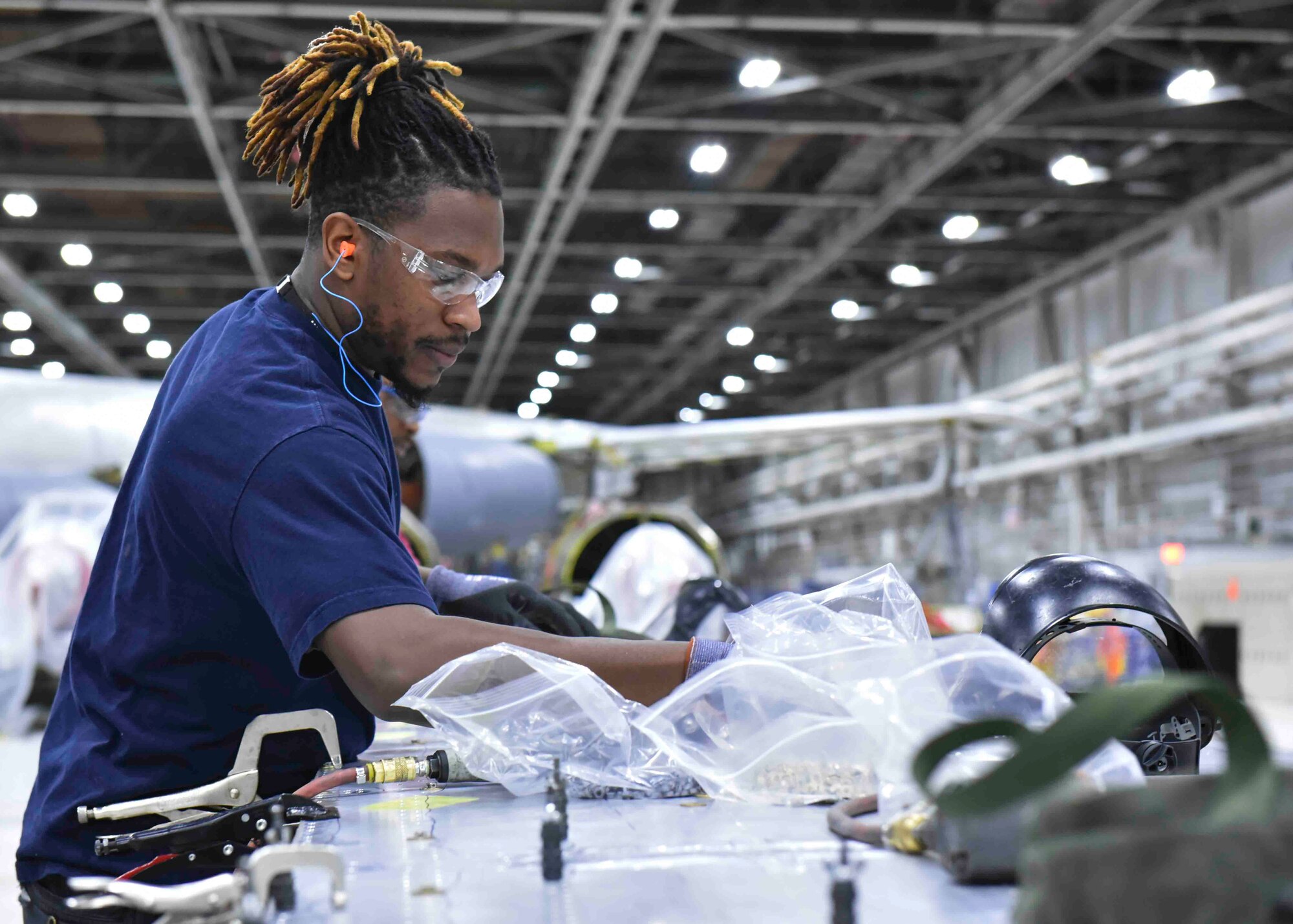 A 564th Air Maintenance Squadron worker reviews a KC-135 Stratotanker maintenance kit on at the Oklahoma City Air Logistics Complex at Tinker Air Force Base, Oklahoma, Nov. 23, 2019. The OC-ALC has kits in place near aircraft containing parts and information to expedite processes and save the U.S. Air Force man-hours and money while maintaining proper maintenance and safety procedures. (U.S. Air Force photo by Airman Kiaundra Miller)