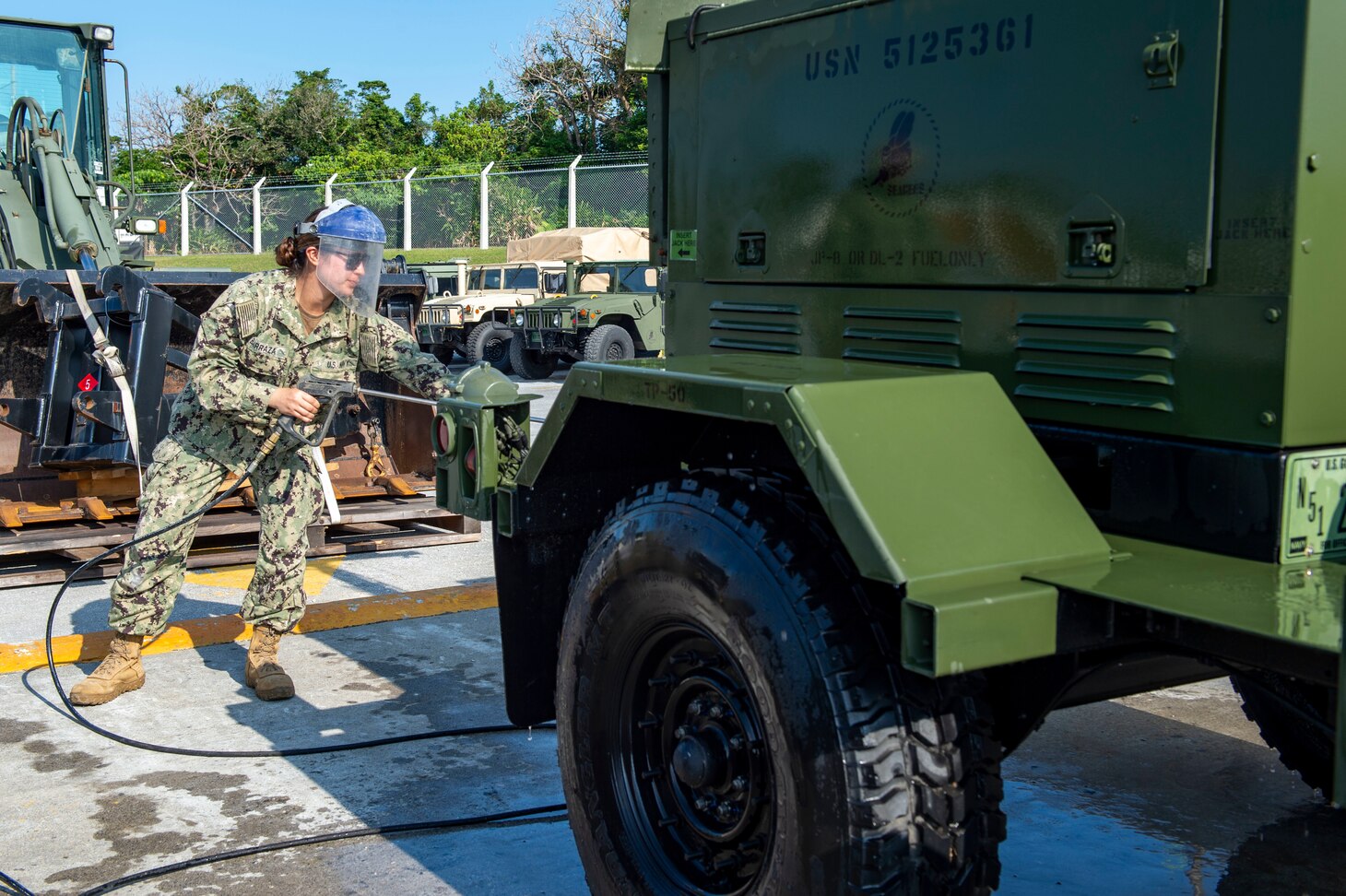 OKINAWA, Japan (Dec. 16, 2019) Construction Electrician Constructionman Adrianna Barraza, deployed with Naval Mobile Construction Battalion (NMCB) 5, cleans a light plant at the wash wrack during a 48-hour Mount-Out Exercise on board Camp Shields, Okinawa. This exercise tests the battalion’s ability to deploy 89 personnel and 35-45 pieces of civil engineer support equipment within 48-hours to support major combat operations or humanitarian aid/disaster relief. NMCB-5 is deployed across the Indo-Pacific region conducting high-quality construction to support U.S. and partner nations to strengthen partnerships, deter aggression, and enable expeditionary logistics and naval power projection.