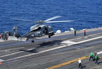 191220-N-WR846-0151 NORTH ARABIAN SEA (Dec. 20, 2019) An MH-60R Sea Hawk helicopter, attached to the "Proud Warriors" of Helicopter Maritime Strike Squadron (HSM) 72, lands on the flight deck of the aircraft carrier USS Harry S. Truman (CVN 75) in the Arabian Sea, Dec. 20, 2019. The Harry S. Truman Carrier Strike Group is deployed to the U.S. 5th Fleet area of operations in support of naval operations to ensure maritime stability and security in the Central Region, connecting the Mediterranean and the Pacific through the western Indian Ocean and three strategic choke points. (U.S. Navy photo by Mass Communication Specialist 2nd Class Jake Carrillo)