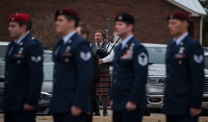 A piper plays taps during the military funeral honors of U.S. Air Force Staff Sgt. Cole Condiff, a Special Tactics combat controller, at the Church of Jesus Christ of Latter-day Saints, Richardson, Texas, Dec. 21, 2019. Condiff, assigned to the 23rd Special Tactics Squadron, Hurlburt Field, Florida, had an unplanned parachute departure from a C-130 aircraft Nov. 5, 2019, over the Gulf of Mexico. (U.S. Air Force photo by Senior Airman Rachel Williams)