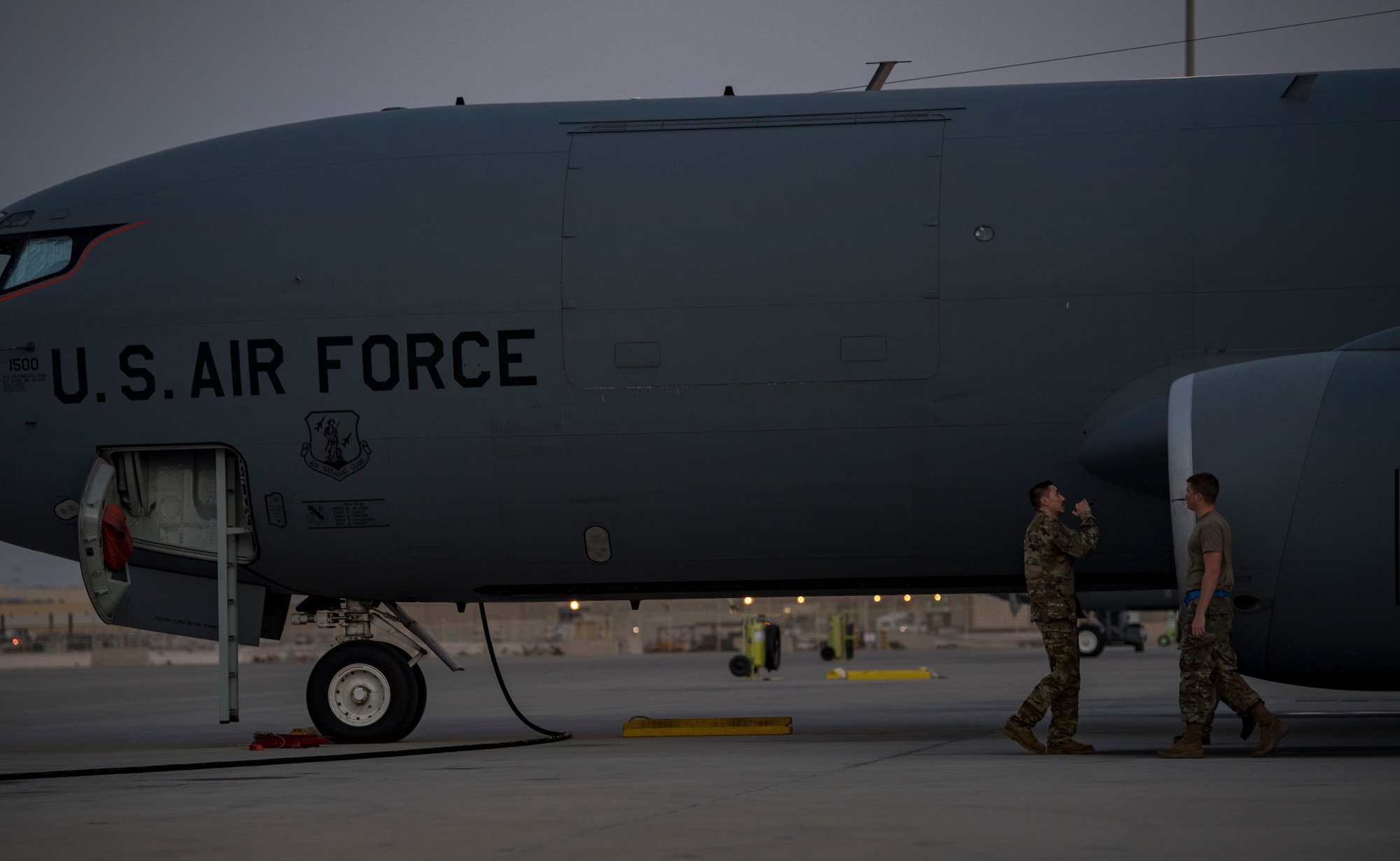 A U.S. Air Force KC-135 Stratotanker pilot and a crew chief with the 28th Expeditionary Air Refueling Squadron conduct a preflight inspection at Al Udeid Air Base, Qatar, Dec. 6, 2019.