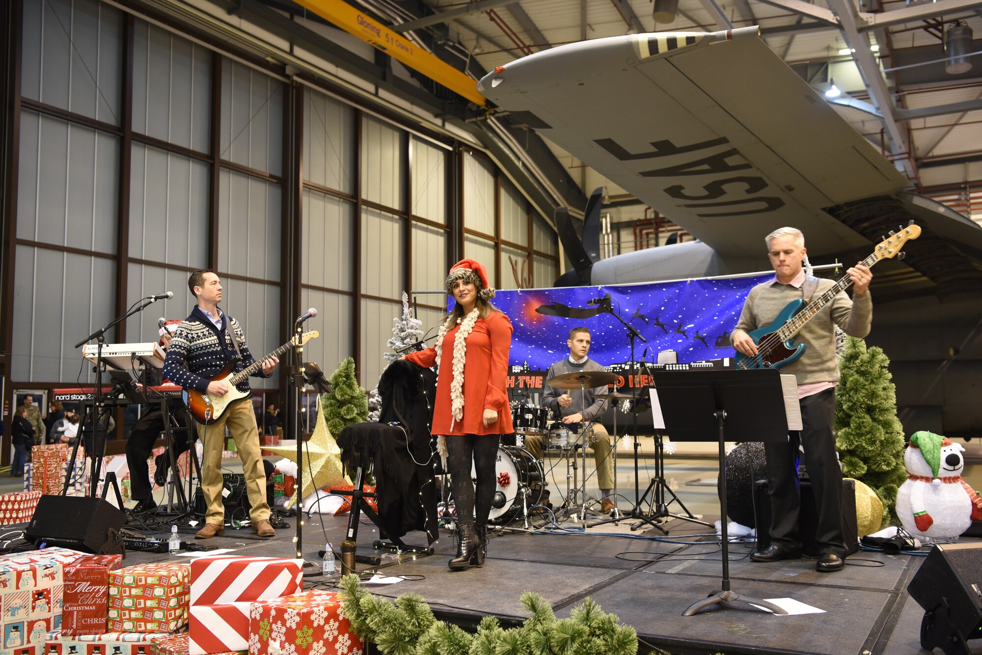 Touch 'n Go, U.S. Air Forces in Europe Band, perform forfamilies during the Rudolph the Red Nosed Herc event at Ramstein Air Base,Germany, Dec. 20, 2019.