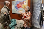 Capt. James Tollefson, Alaska Army National Guard recruiting and retention operations officer, talks with Carol Piscoya, vice president of community services division at Kawerak Inc., at the Katirvik Cultural Center in Nome, Alaska, Dec. 18, 2019. Members of the Alaska Department of Military and Veterans Affairs visited Nomeas part of the department’s new rural operations hub concept to strengthen ties with Alaska’s rural communities.