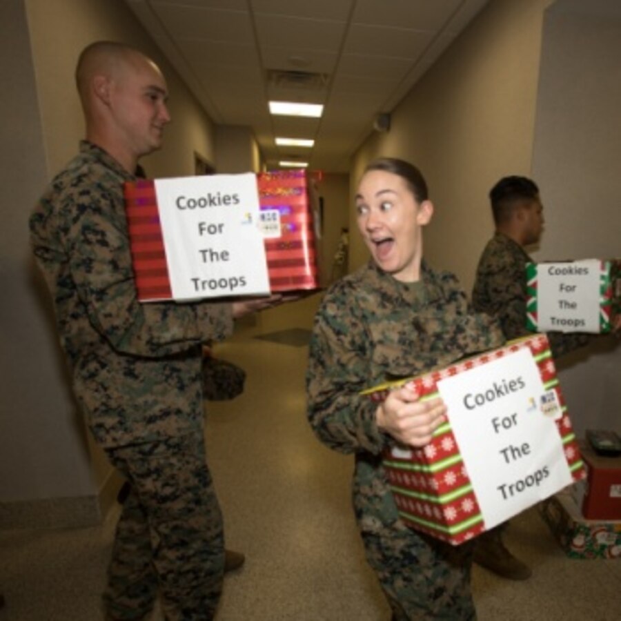 U.S. Marine Corps Sgt. Teresa Rigby, a legal services specialist assigned to Headquarters and Headquarters Squadron, takes boxes of baked goods back to her unit with other Marines during the annual cookie drop event at MCAS Cherry Point, North Carolina, Dec. 16, 2019. The cookie drop organized by Carteret County’s Chamber of Commerce’s Military Affairs Committee, donates baked goods to the Marines and Sailors on duty at the air station. Elementary school students from Carteret County made unique Christmas cards in the boxes to wish the service members a happy holiday season. (U.S. Marine Corps photo by Cpl. Micha Pierce)