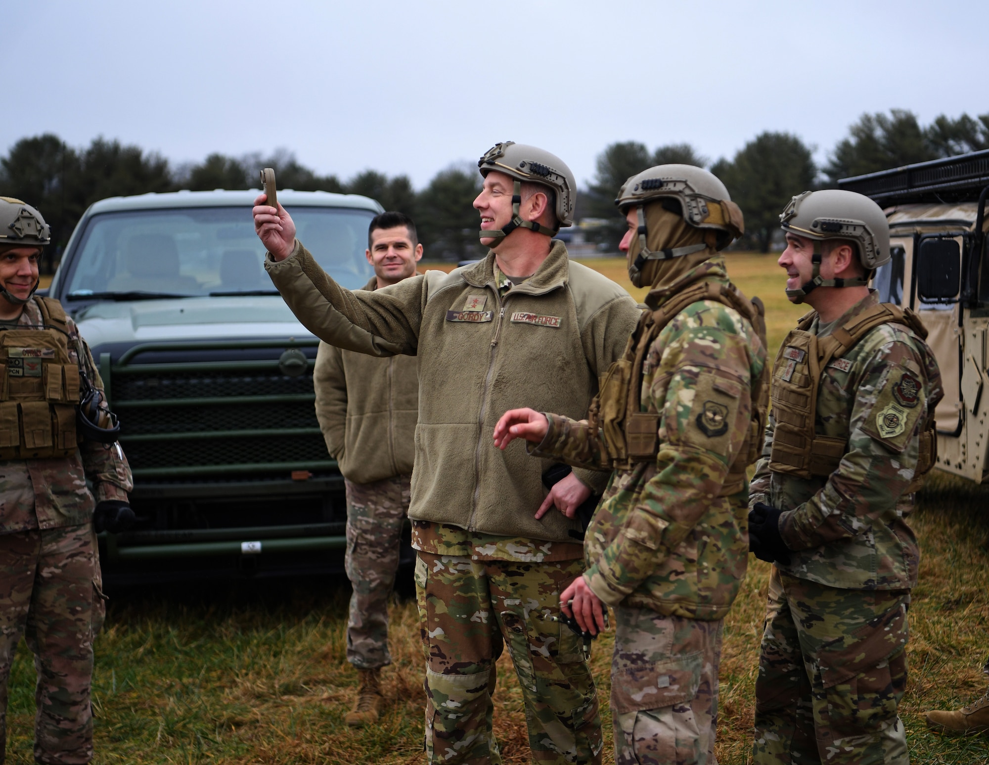 Maj. Gen. John Gordy (center), U.S. Air Force Expeditionary Center commander, handles a weather tracking tool at the Global Deployment Readiness Center Training Field, Joint Base McGuire-Dix-Lakehurst, New Jersey Dec. 17, 2019. Gordy spent the day with 621st Contingency Response Wing Airmen learning various aspects of the CRW mission. (U.S. Air Force photo by Tech. Sgt. Luther Mitchell)