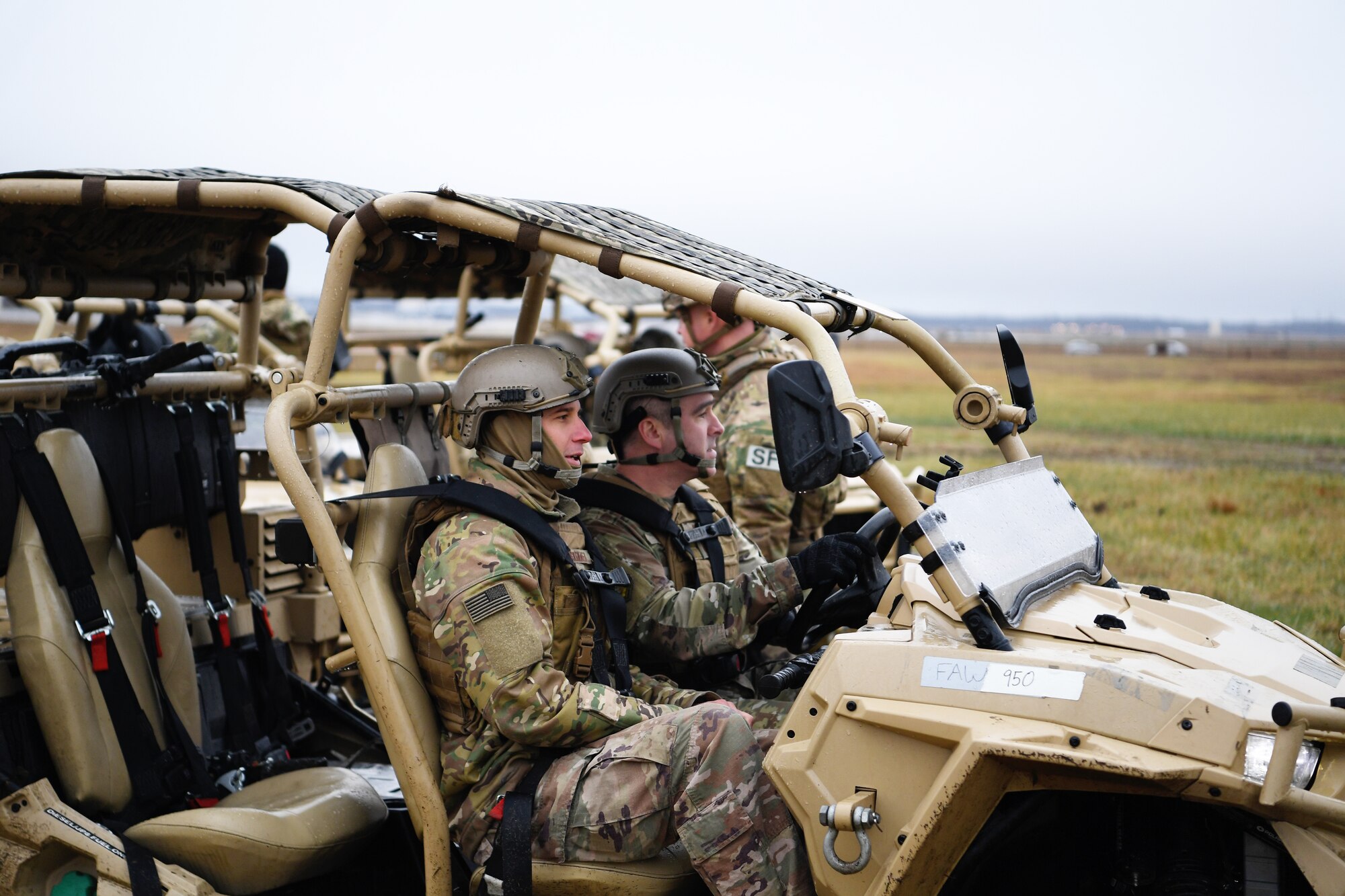 Chief Master Sgt. Kristopher Berg, U.S. Air Force Expeditionary Center command chief, operates a Polaris MRZR at the Global Deployment Readiness Center Training Field, Joint Base McGuire-Dix-Lakehurst, New Jersey Dec. 17, 2019. Gordy along with Chief Master Sgt. Kristopher Berg, USAF EC command chief, spent the day learning about the CRW mission. (U.S. Air Force photo by Tech. Sgt. Luther Mitchell)