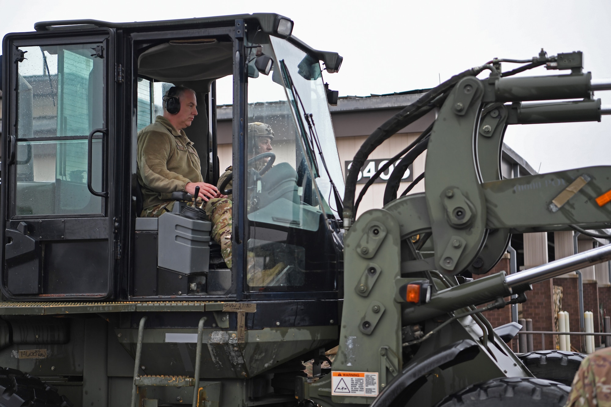 Maj. Gen. John Gordy, U.S. Air Force Expeditionary Center commander, operates a 10K All Terrain forklift at the Global Deployment Readiness Center, Joint Base McGuire-Dix-Lakehurst, New Jersey Dec. 17, 2019. Gordy spent the day with 621st Contingency Response Wing Airmen learning various aspects of the CRW mission. (U.S. Air Force photo by Tech. Sgt. Luther Mitchell)
