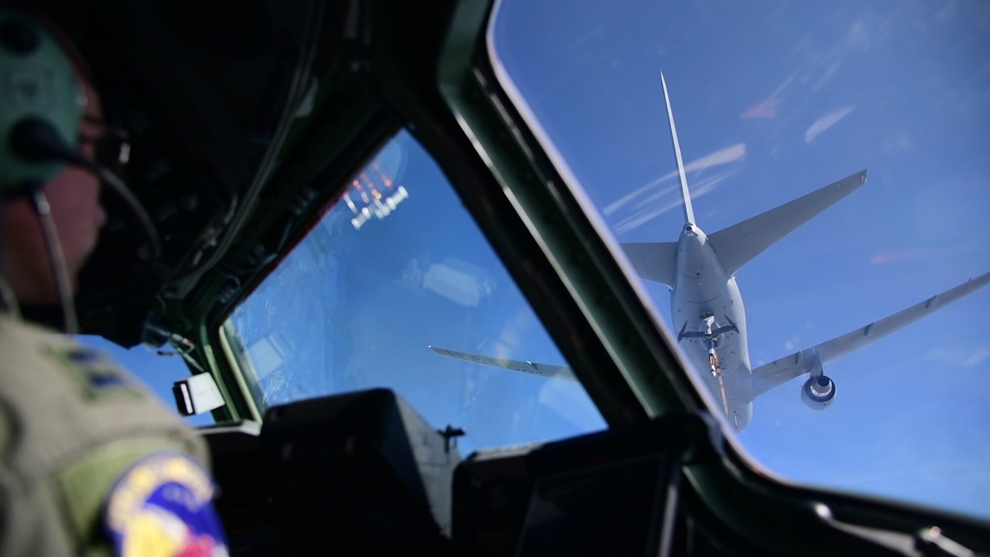 Capt. Chris Rogoski, a pilot assigned to the 3rd Airlift Squadron, Dover Air Force Base, Del., flies a C-17 Globemaster III during air refueling training with a Boeing KC-46A Pegasus on March 22, 2019 near Fairchild Air Force Base, Wash. The training marks the first time a Dover AFB aircraft and 3rd Airlift Squadron C-17 has refueled with the new KC-46 tanker (U.S. Air Force photo by Tech. Sgt. Laura Beckley).