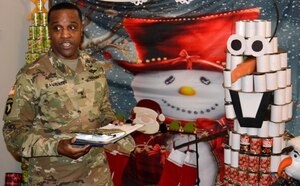DLA Troop Support Commander Army Brig. Gen. Gavin Lawrence addresses employees from the Medical supply chain Dec. 20, 2019, in Philadelphia during the judging of this year’s holiday decorating contest.