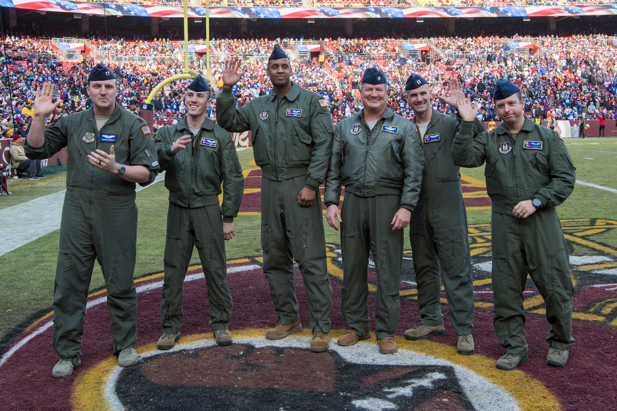 U.S. Airmen with the 732nd Airlift Squadron, 514th Air Mobility Wing and the 6th Airlift Squadron, 305th Air Mobility Wing are recognized for their military service and a fly-over they performed prior to a football game at FedEx Field, Landover, Md., Dec. 22, 2019.