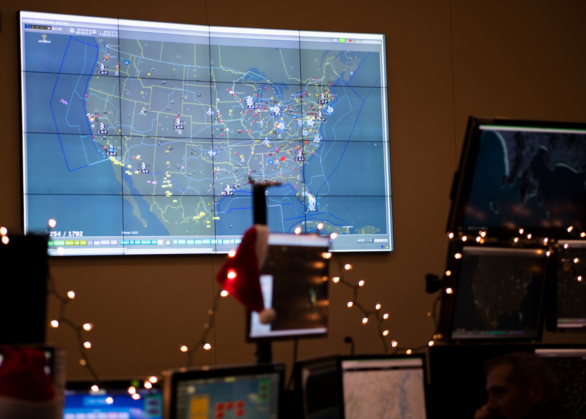 North American Aerospace Defense Command’s operations center tracks flight patterns at Tyndall Air Force Base, Florida, Dec. 23, 2019. As part of NORAD Tracks Santa, satellite technology provides real time updates on Santa’s location around the world. (U.S. Air Force photo by Senior Airman Cheyenne Larkin)