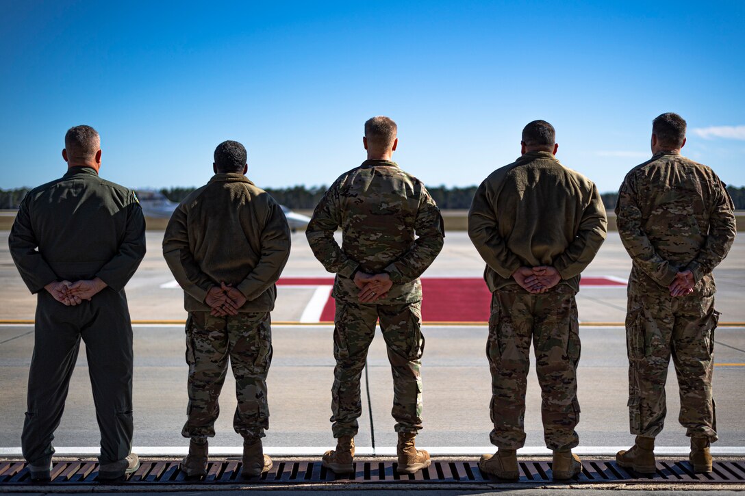 A photo of Airmen standing at parade rest