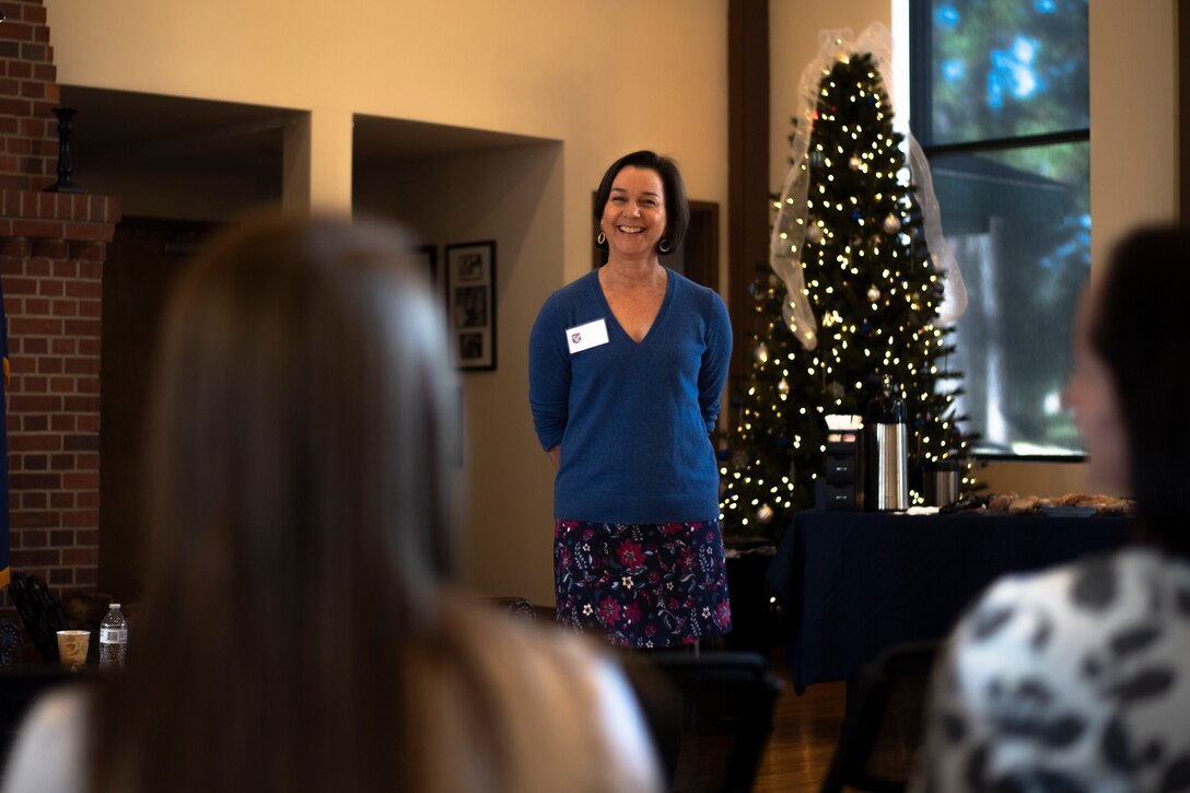 A photo of the wife of the commander of Air Combat Command speaking with a key spouse