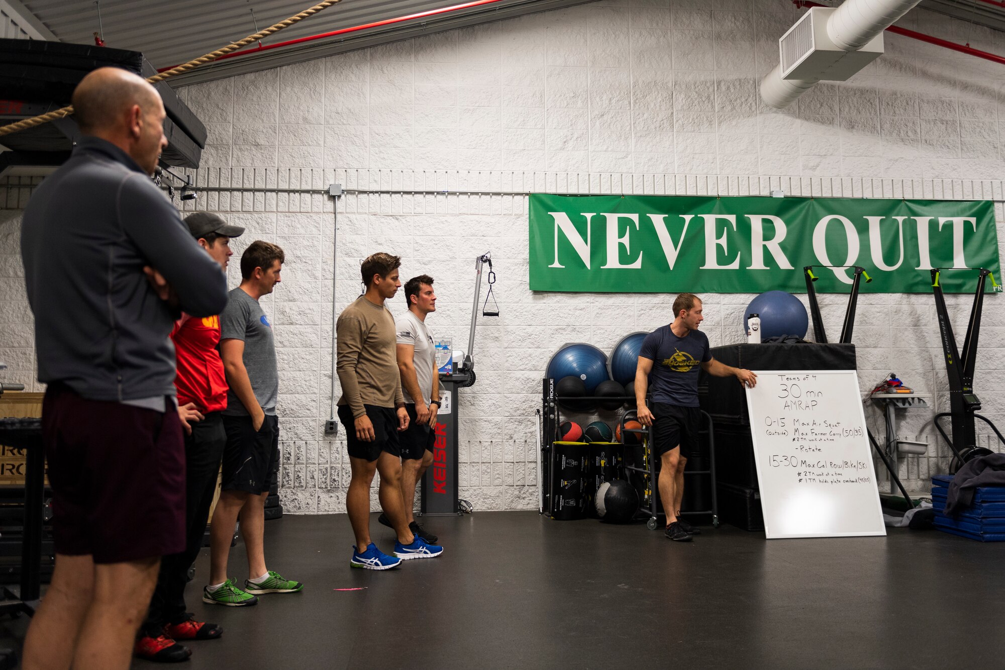 A photo of Airmen listening to an exercise plan