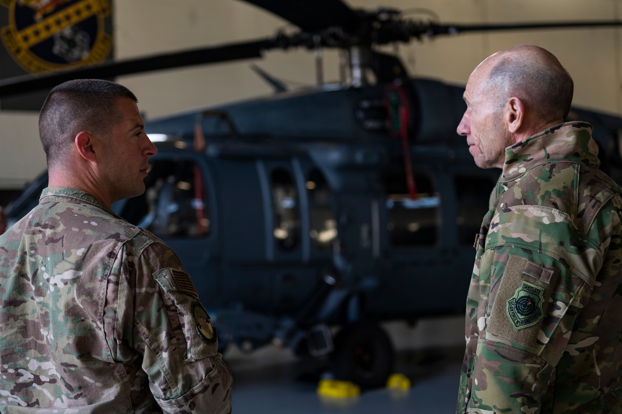 A photo of two Airmen talking