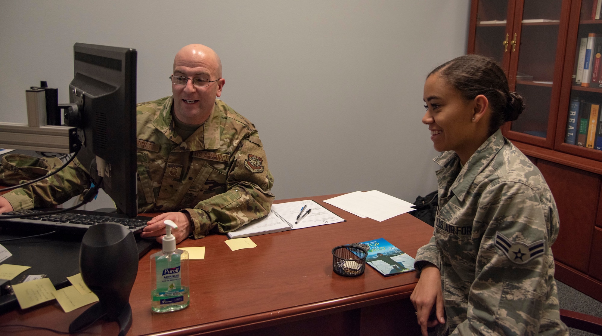 U.S. Air Force Master Sgt. Benjamin Barrett, 92nd Force Support Squadron career assistance advisor, gives Airman 1st Class Kiaundra Miller, 92nd Air Refueling Wing Public Affairs photojournalist, career advice at Fairchild Air Force Base, Washington, Dec. 18, 2019. Team Fairchild’s career assistance advisor provides resources and a better look at options when Airmen arrive at a crossroads in their career. (U.S. Air Force photo by Airman Anneliese Kaiser)