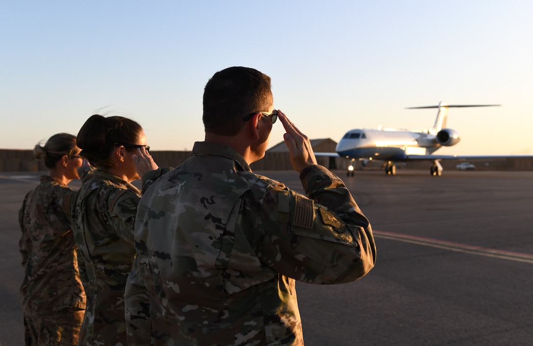 The 409th Air Expeditionary Group leadership salutes Secretary of the Air Force Barbara M. Barrett as she arrives at Nigerien Air Base 201, Niger, Dec. 21, 2019. During her first visit to the African continent since taking office in October, Barrett’s focus was centered solely on the U.S. service members deployed there. (U.S. Air Force photo by Staff Sgt. Alex Fox Echols III)