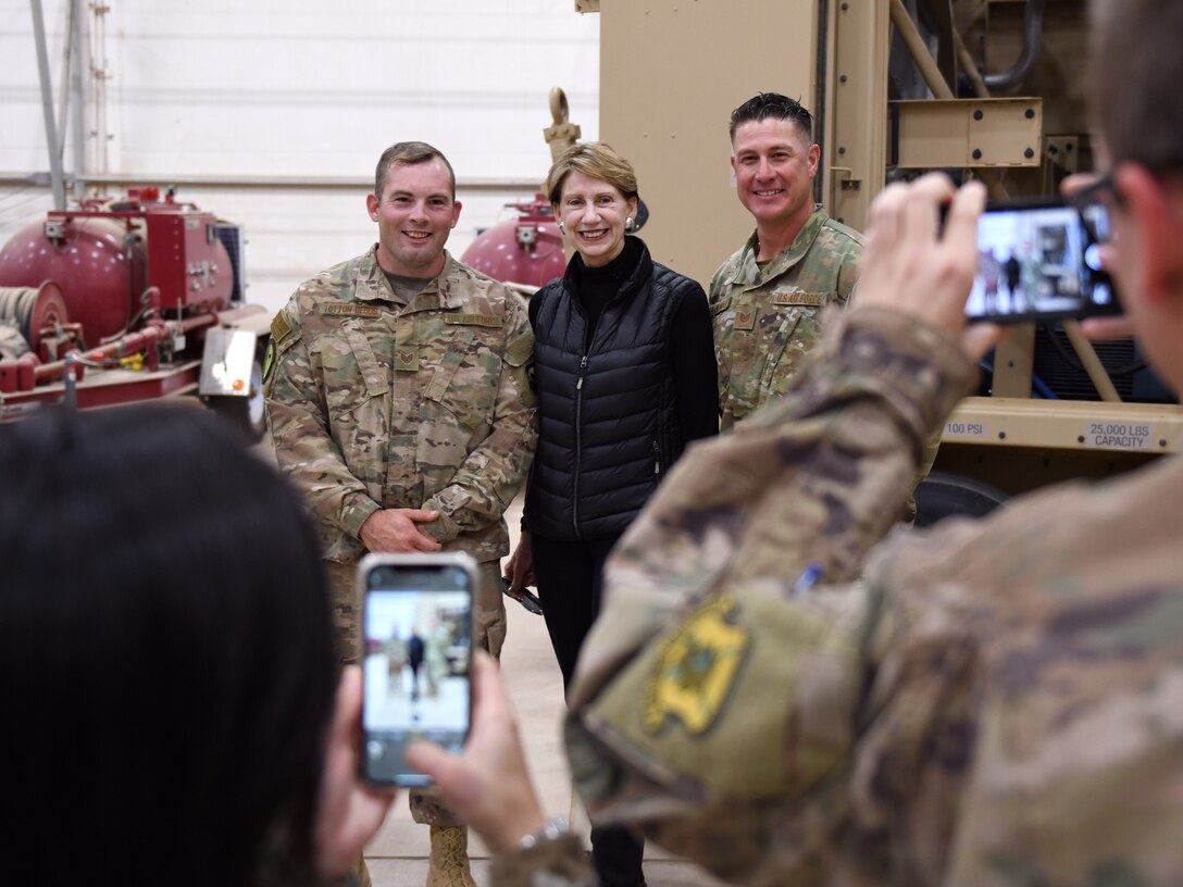 Secretary of the Air Force Barbara M. Barrett takes a photo with Airmen deployed to the 724th Expeditionary Air Base Squadron during her visit to Nigerien Air Base 201, Niger, Dec. 21, 2019. During her first visit to the African continent since taking office in October, Barrett’s focus was centered solely on the U.S. service members deployed there. (U.S. Air Force photo by Staff Sgt. Alex Fox Echols III)