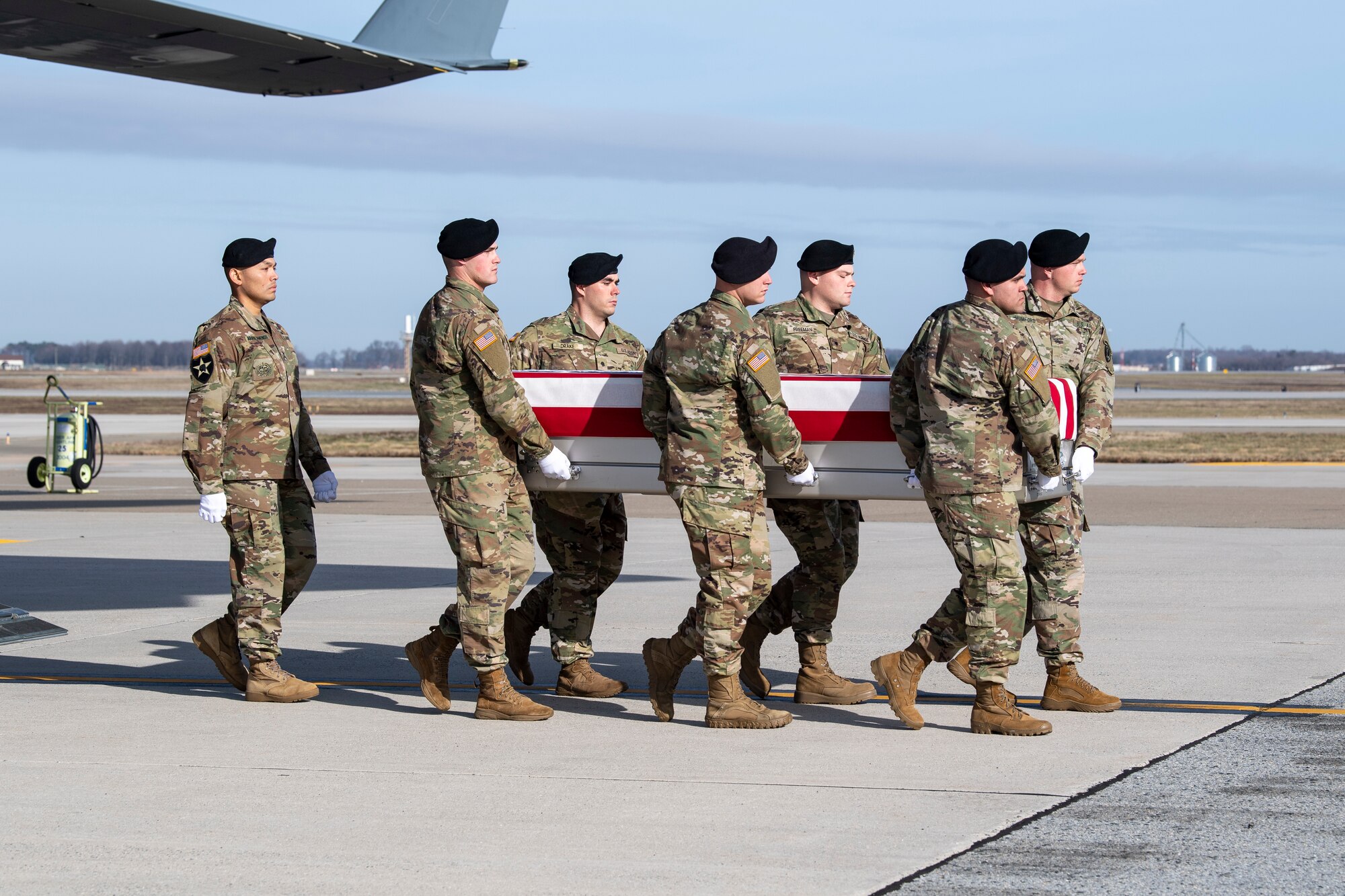 A U.S. Army carry team transfers the remains of Sgt. 1st Class Michael J. Goble, of Washington Township, N.J., Dec. 25, 2019 at Dover Air Force Base, Del. Goble was assigned to the 1st Battalion, 7th Special Forces Group (Airborne), Eglin Air Force Base, Fla. (U.S. Air Force Photo by Senior Airman Christopher Quail)