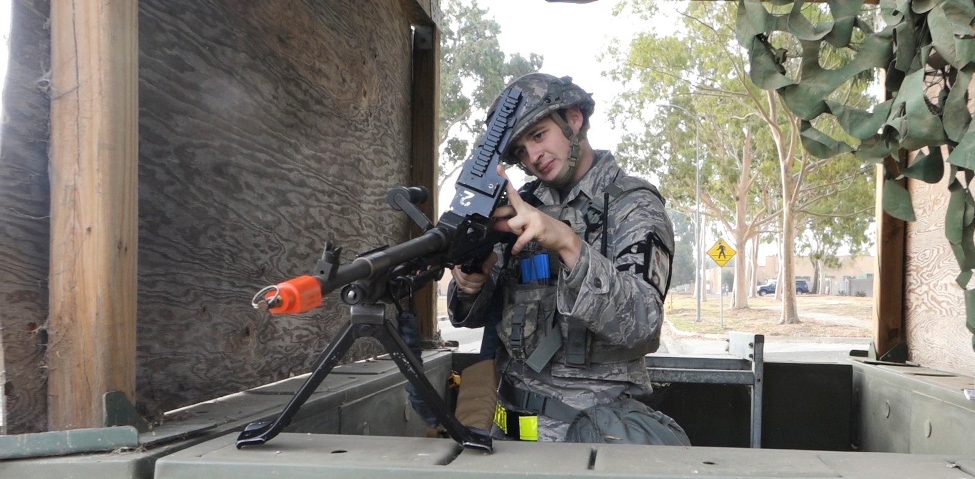 Air National Guard Staff Sgt. Stephen Holmes from the 146th Airlift Wing’s Security Forces Squadron examines his weapon inside a modified security checkpoint during a readiness exercise at the Channel Islands Air National Guard Station, Port Hueneme, California, Nov. 14, 2019.