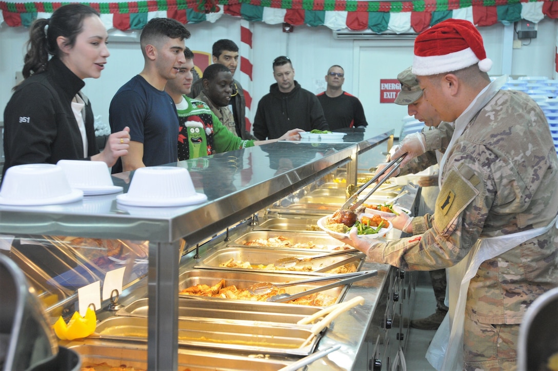 77th Sustainment Brigade continue the tradition of serving a holiday meal