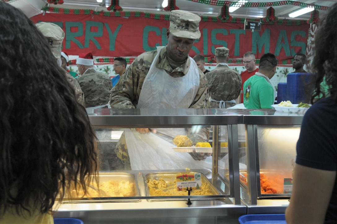 77th Sustainment Brigade continue the tradition of serving a holiday meal