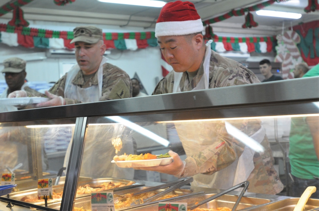 77th Sustainment Brigade continue the tradition of serving a holiday meal