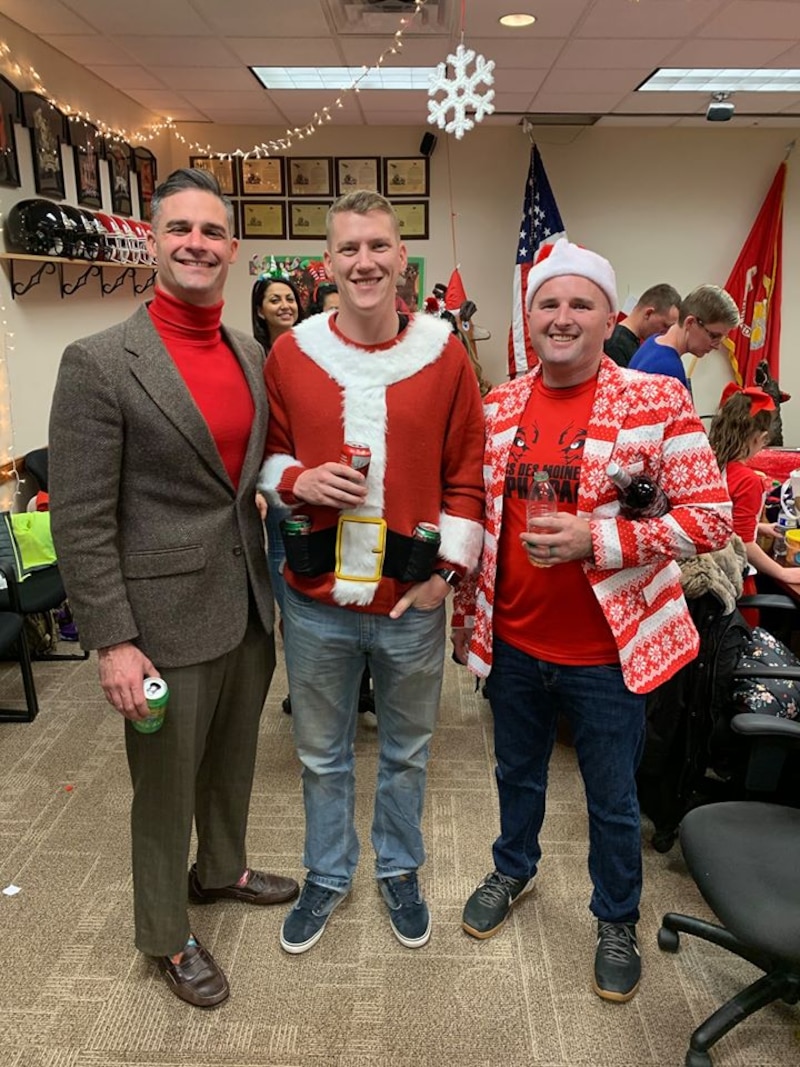 Maj. Patrick Skehan, Staff Sgt. McCoy Herold and Staff Sgt. Andrew Miller pose for a picture at the Recruiting Station Des Moines Iowa/Nebraska Christmas Part Dec 14, 2019. The recruiting staff from Iowa and Nebraska took some time to enjoy family, friends and fun during the holiday season.
