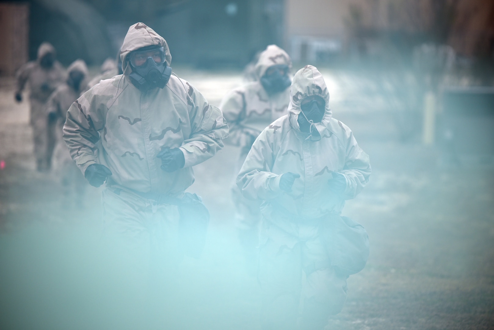 Soldiers wearing Mission Oriented Protective Posture, or MOPP, protective gear react to a simulated Chemical, Biological, Radiological, and Nuclear, or CBRN, attack at Joint Base San Antonio-Camp Bullis
