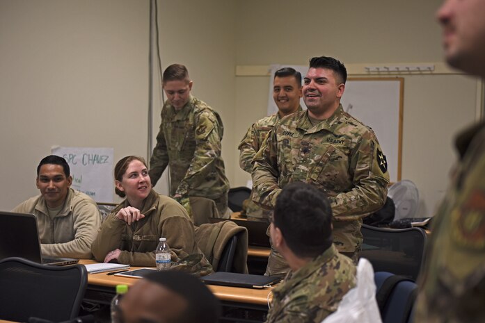 U.S. Army Specialist Israel Chavez, Gray Eagle Company mechanic, practices negotiation tactics during Airman Leadership School at Kunsan Air Base, Republic of Korea, Dec. 13, 2019. ALS is a five week-long Air Force professional military education course designed to develop junior enlisted service members into effective supervisors, leaders and NCOs. It is the first PME course that enlisted Airmen encounter during their Air Force career. (U.S. Air Force photo by Staff Sgt. Mackenzie Mendez)