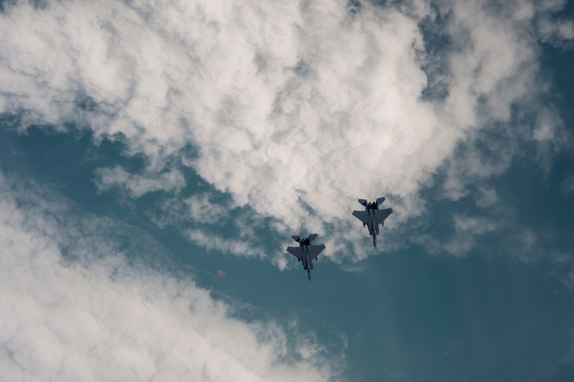 Two U.S. Air Force F-15E Strike Eagles assigned to the 494th Expeditionary Fighter Squadron, fly enroute to participate in a fly over honoring Qatar National Day, Dec. 18, 2019.