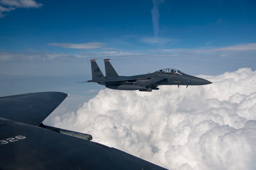 U.S. Air Force F-15E Strike Eagles assigned to the 494th Expeditionary Fighter Squadron, fly enroute to participate in a 4-ship formation fly over honoring Qatar National Day, Dec. 18, 2019.