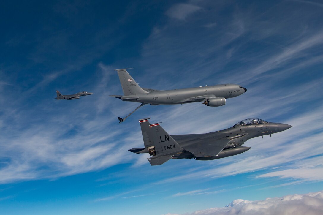U.S. Air Force F-15E Strike Eagles assigned to the 494th Expeditionary Fighter Squadron, refuel from a KC-135 Stratotanker assigned to the 28th Expeditionary Air Refueling Squadron enroute to participate in a formation fly over honoring Qatar National Day, Dec. 18, 2019.