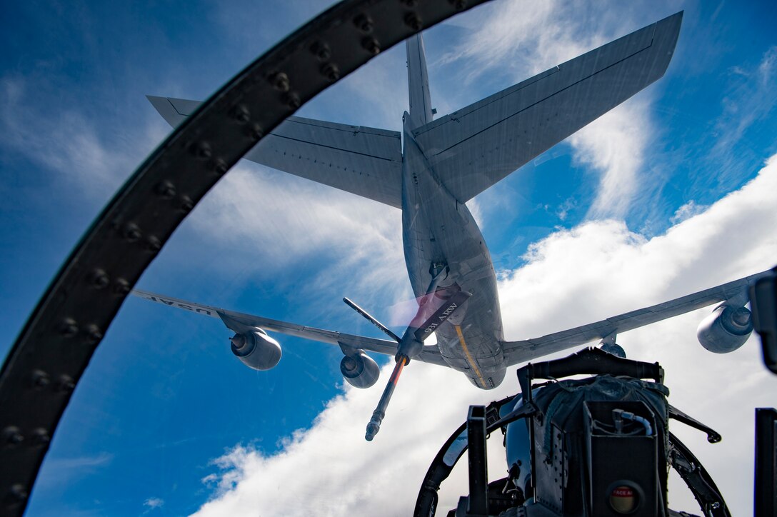 A U.S. Air Force F-15E Strike Eagle assigned to the 494th Expeditionary Fighter Squadron, refuels from a KC-135 Stratotanker assigned to the 28th Expeditionary Air Refueling Squadron enroute to participate in a formation fly over honoring Qatar National Day, Dec. 18, 2019.