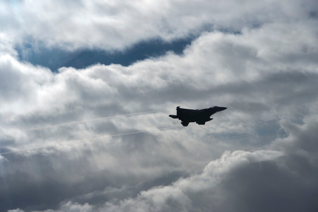 A U.S. Air Force F-15E Strike Eagle assigned to the 494th Expeditionary Fighter Squadron, flies enroute to participate in a formation fly over honoring Qatar National Day, Dec. 18, 2019.