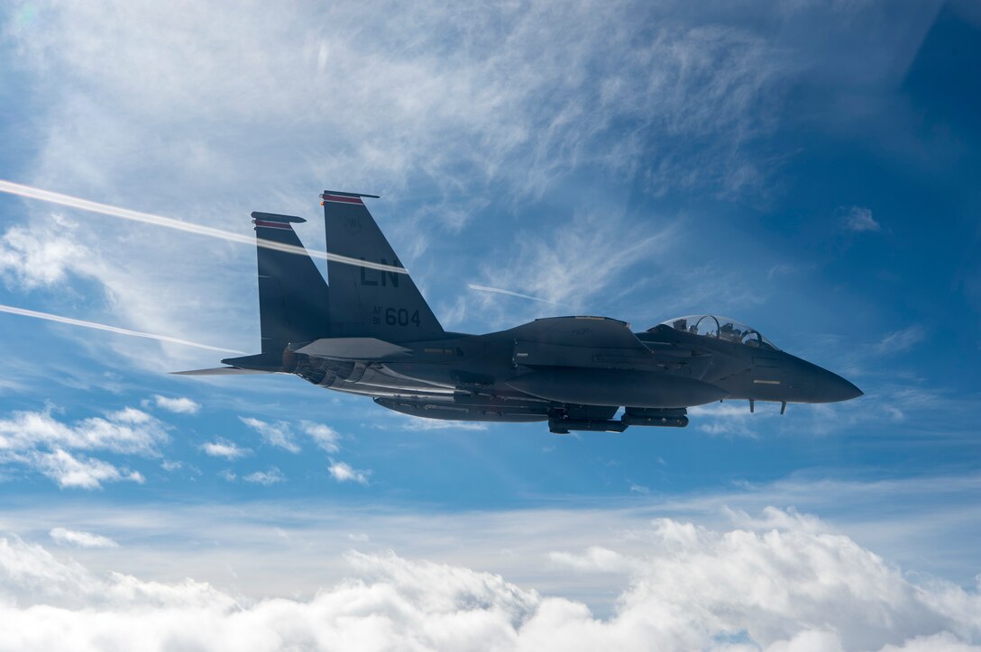 A U.S. Air Force F-15E Strike Eagle assigned to the 494th Expeditionary Fighter Squadron, flies enroute to participate in a formation fly over honoring Qatar National Day, Dec. 18, 2019.