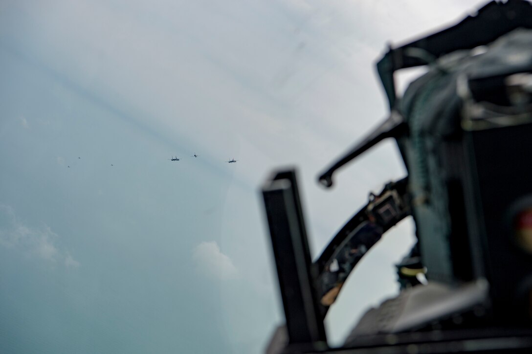 A U.S. Air Force F-15E Strike Eagle assigned to the 494th Expeditionary Fighter Squadron, participates a formation fly-by, that included 75 other aircraft, honoring Qatar National Day, Doha, Qatar Dec. 18, 2019.