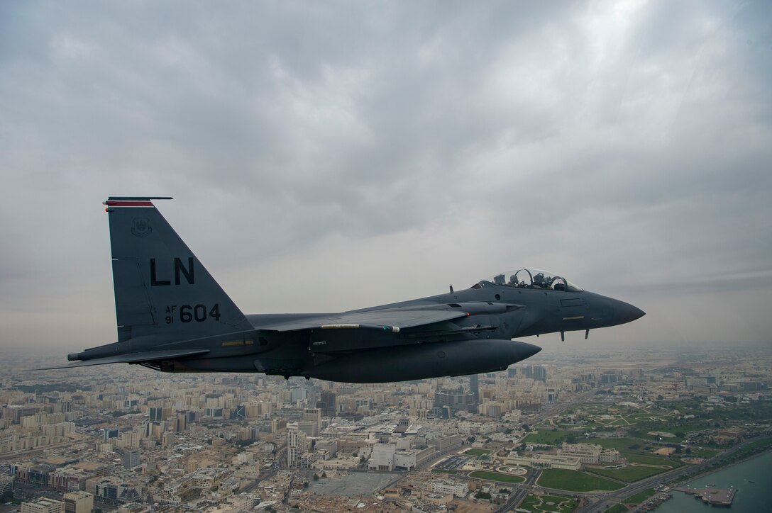 A U.S. Air Force F-15E Strike Eagle assigned to the 494th Expeditionary Fighter Squadron, conducts a formation fly over honoring Qatar National Day, Doha, Qatar Dec. 18, 2019.