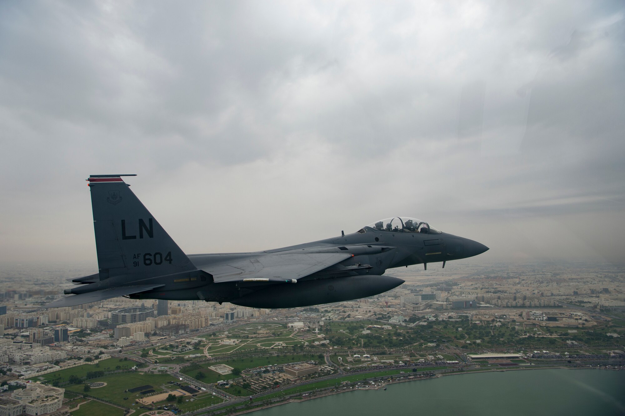 A U.S. Air Force F-15E Strike Eagle assigned to the 494th Expeditionary Fighter Squadron, conducts a formation fly over honoring Qatar National Day, Doha, Qatar Dec. 18, 2019.
