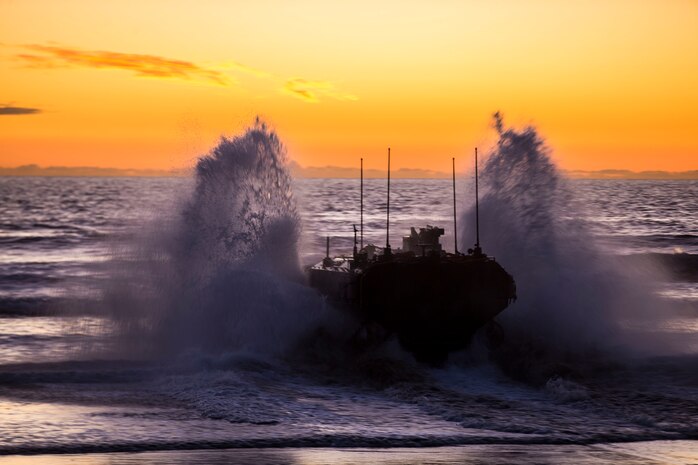 U.S. Marines with Amphibious Vehicle Test Branch, Marine Corps Tactical Systems Support Activity, drive a new Amphibious Combat Vehicle into the ocean during low-light surf transit testing at AVTB Beach on Marine Corps Base Camp Pendleton, California, Dec. 18.