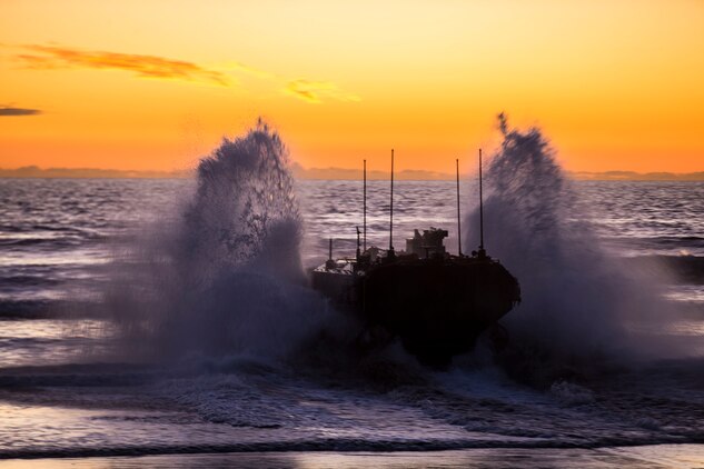 U.S. Marines with Amphibious Vehicle Test Branch, Marine Corps Tactical Systems Support Activity, drive a new Amphibious Combat Vehicle into the ocean during low-light surf transit testing at AVTB Beach on Marine Corps Base Camp Pendleton, California, Dec. 18.