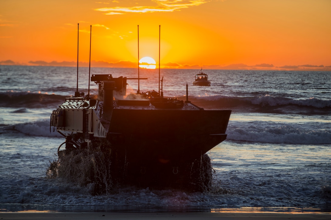 U.S. Marines with Amphibious Vehicle Test Branch, Marine Corps Tactical Systems Support Activity, drive a new Amphibious Combat Vehicle ashore during low-light surf transit testing at AVTB Beach on Marine Corps Base Camp Pendleton, California, Dec. 18.