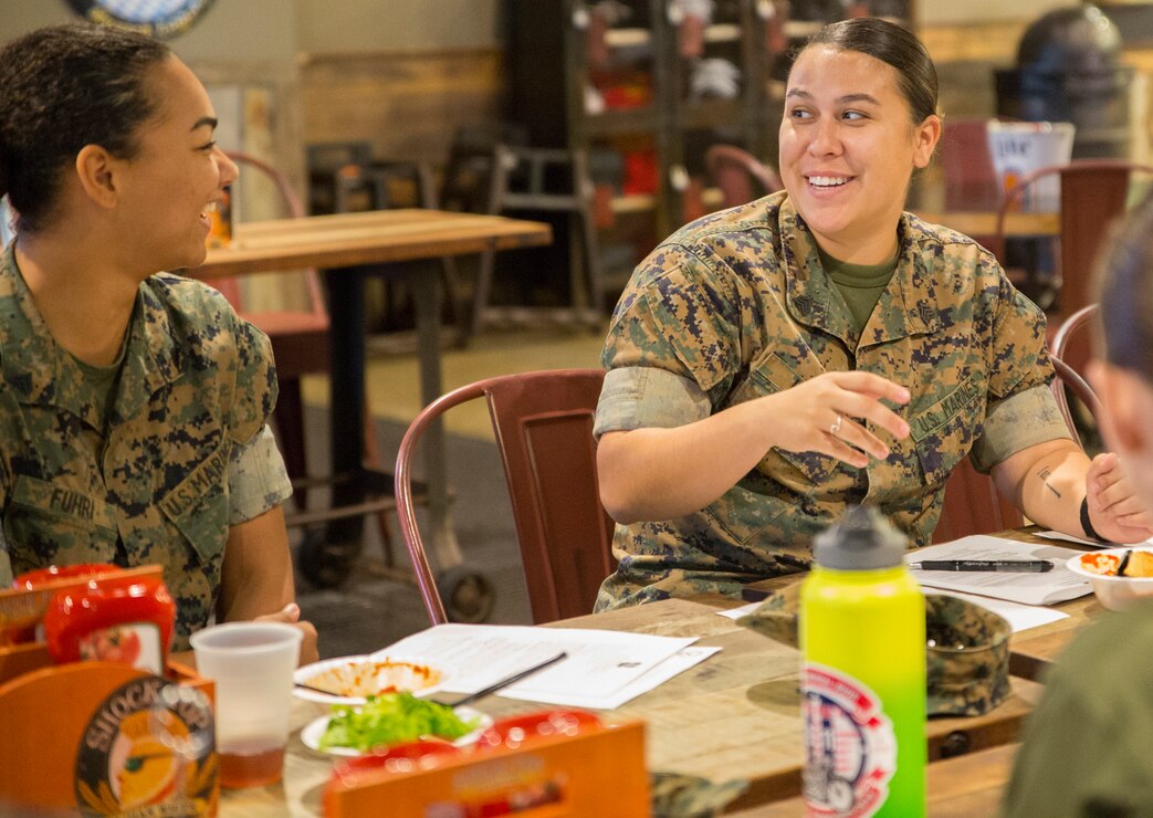 U.S. Marine Corps Sgt. Bianca Huish, right, president of the Single Marine Program Council, sits in session with fellow council representatives during a council meeting at the Roadhouse, Marine Corps Air Station Cherry Point, North Carolina, Oct. 24.