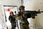 Spc. Jerrad Nicholson, with the Indiana Army National Guard's 1st Squadron, 152nd Cavalry Regiment, leads Soldiers into a room during Slovak Shield 2019, a training exercise in Lešt, Slovakia, Nov. 10, 2019, as part of the Defense Department's State Partnership Program.