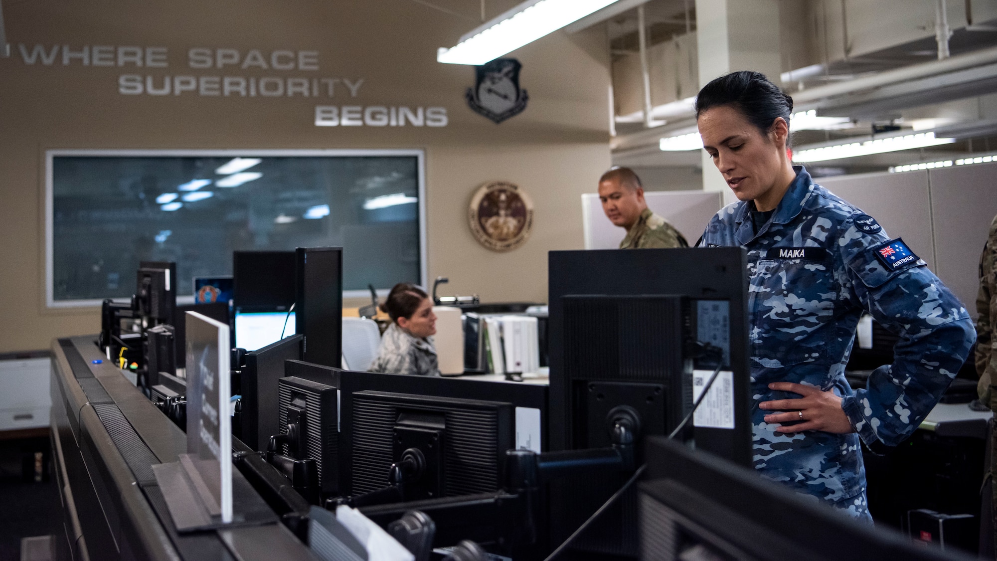 Squadron Leader, Jamiee Maika, of the Royal Australian Air Force operating at the CSpOC at Vandenberg Air Force Base, California, Aug. 28, 2019. This multi-national space force includes a strategic defense partnership between the United States, Canada, Australia, and the United Kingdom. Additional nations collaborating on space operations with the CSpOC include Germany, France and New Zealand. (U.S. Space Force photo by Staff Sgt. J.T. Armstrong)