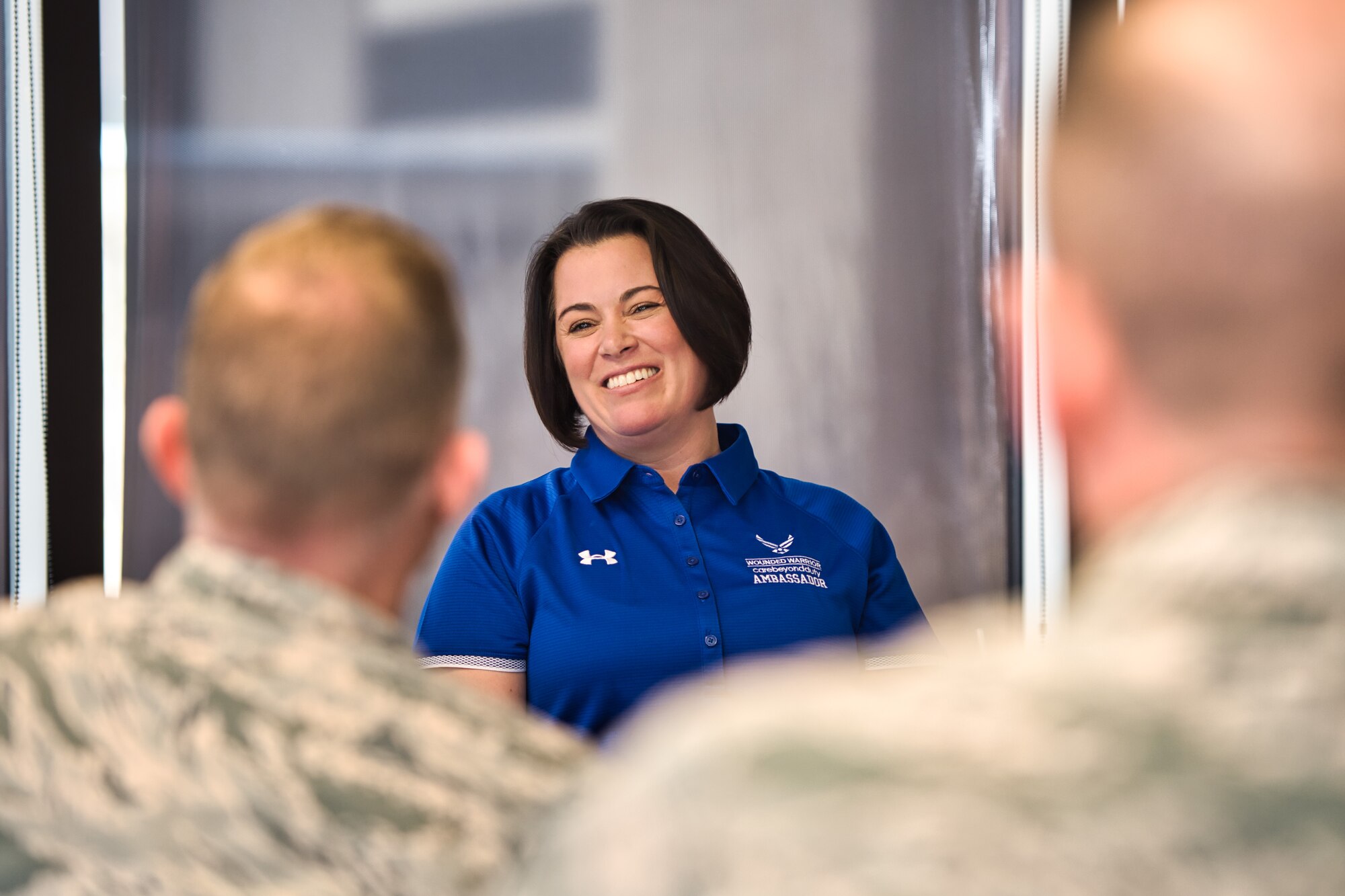 Retired Col. Nicole Malachowski laughs while sharing stories and lunch with Airmen during her visit to Schriever Air Force Base, Colorado, Dec. 19, 2019. Malachowski, who has endured multiple life challenges including suffering from a tick borne illness that ended her career as a fighter pilot, brought a message of hope and resurgence during a speaking engagement later that day. (U.S. Air Force photo by Katie Calvert)