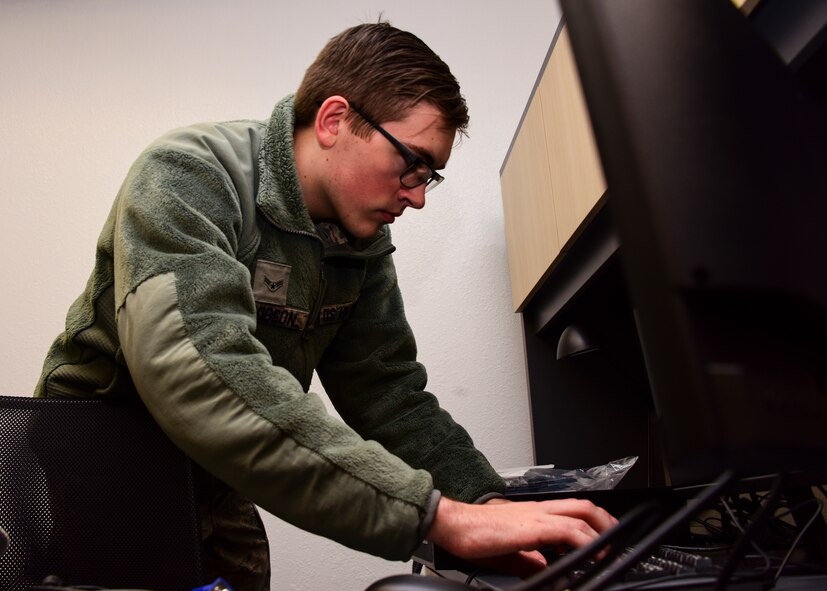Airman works on computer