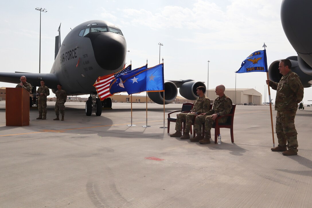 Maj. Gen. Sam Barrett, 18th Air Force commander, addresses the audience during the 385th Air Expeditionary Group change of command ceremony at Al Udeid Air Base, Qatar on Dec. 17, 2019. During the ceremony, Col. Christopher Lay relinquished command to Col. William Gutermuth.(U.S. Air Force photo by Tech. Sgt. Ian Dean)